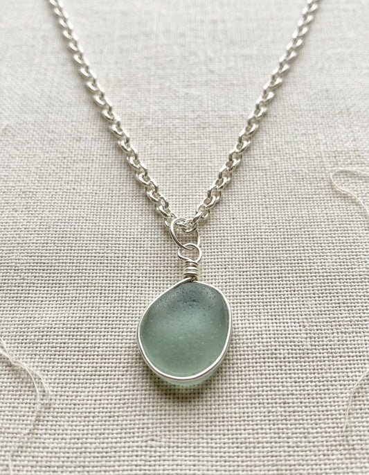 Decorative outer wrapped seaglass pendant on jewellers wire and a silver plated chain