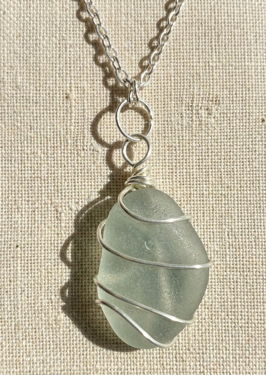 Decorative middle wrapped seaglass pendant with jewellers wire and a silver plated chain